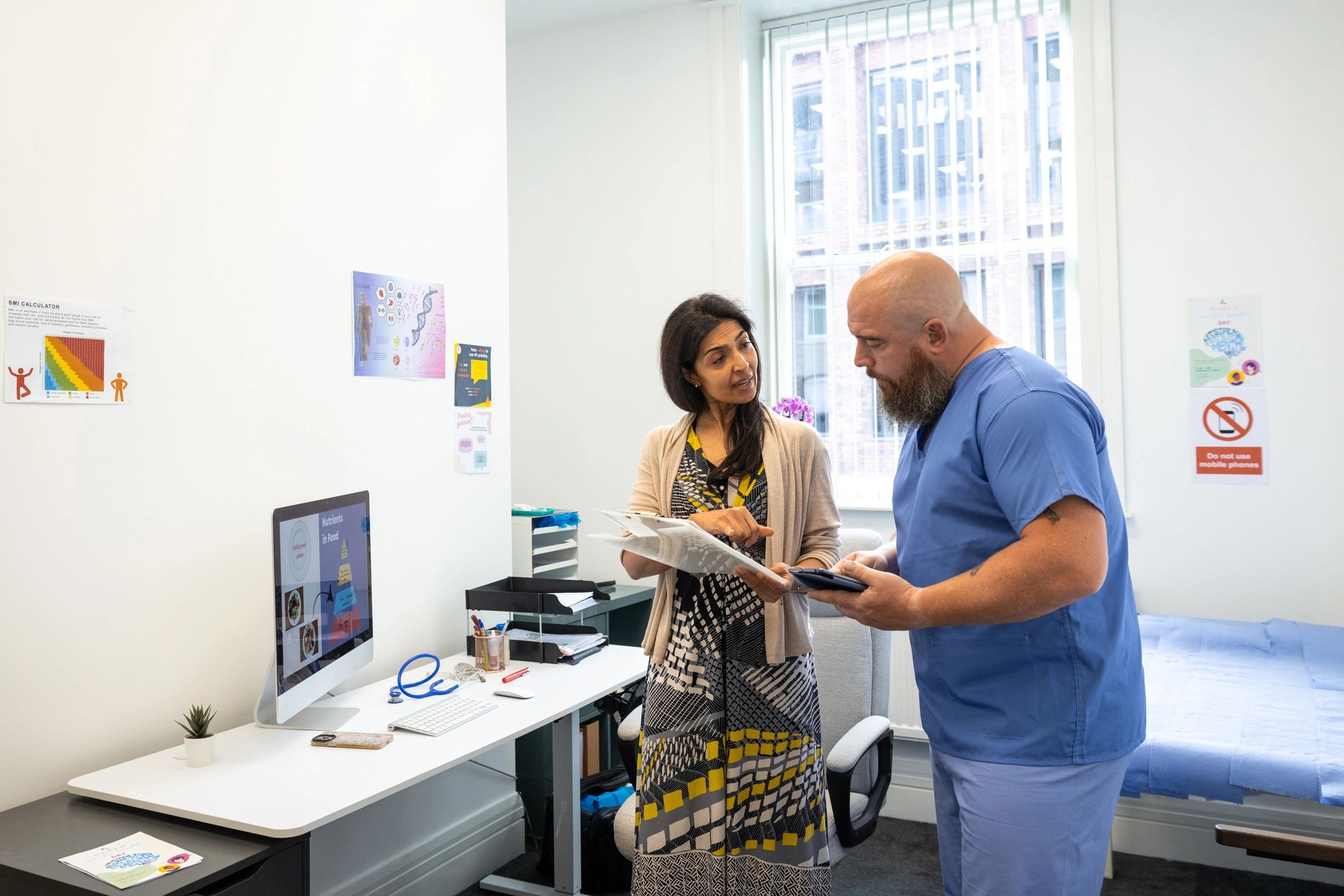 Medical professionals reviewing patient information in a clinic