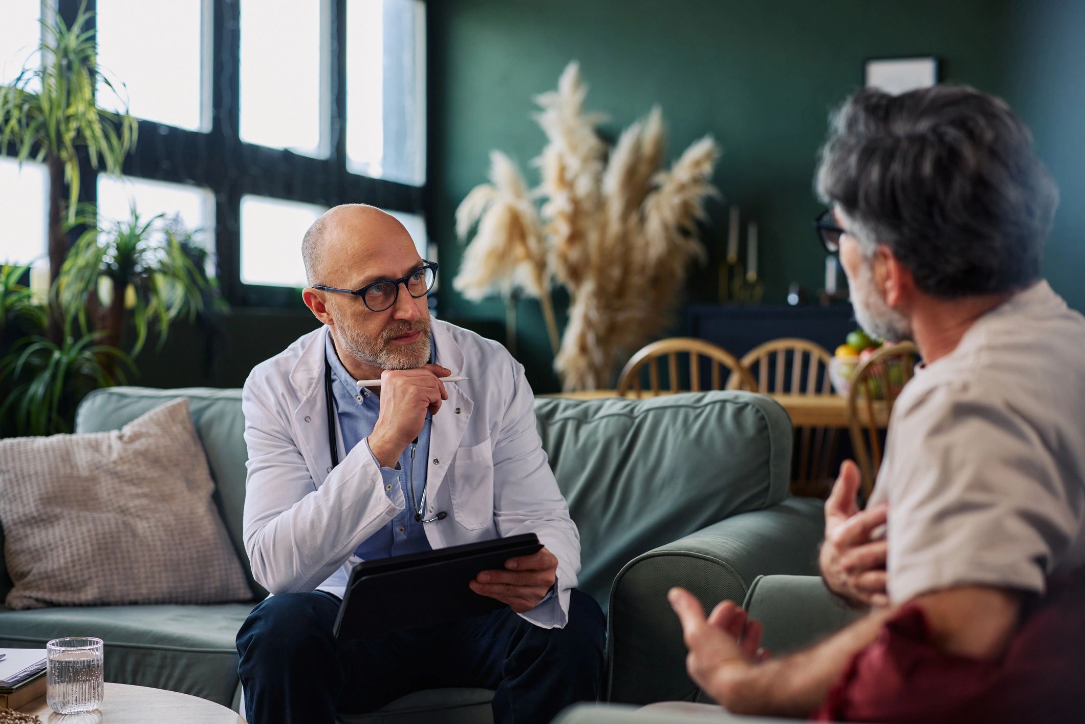 Doctor speaking with a patient in a calm private consultation